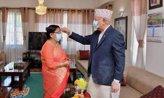 pm-oli-offers-dashain-tika-and-jamara-to-spouse-radhika-shakya