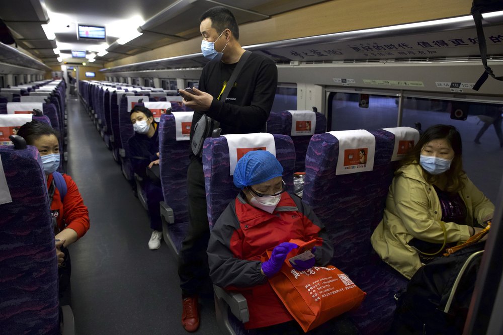 masked-crowds-fill-streets-trains-after-wuhan-lockdown-ends