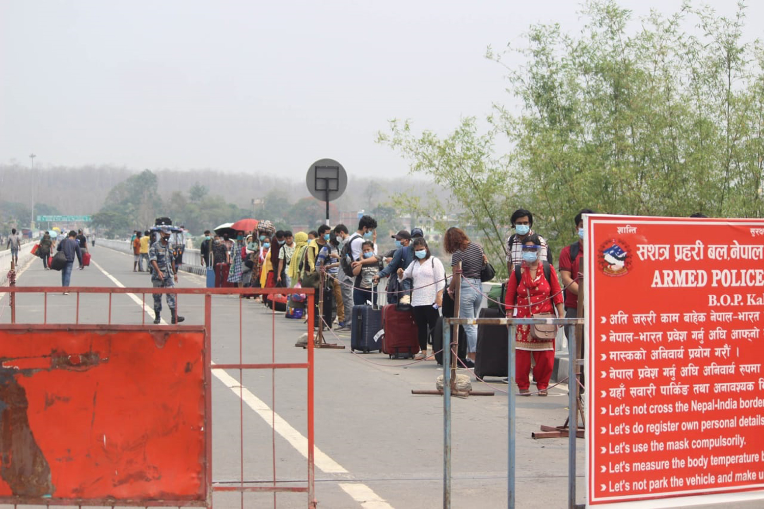 Returning Nepalis being screened for COVID-19 at border