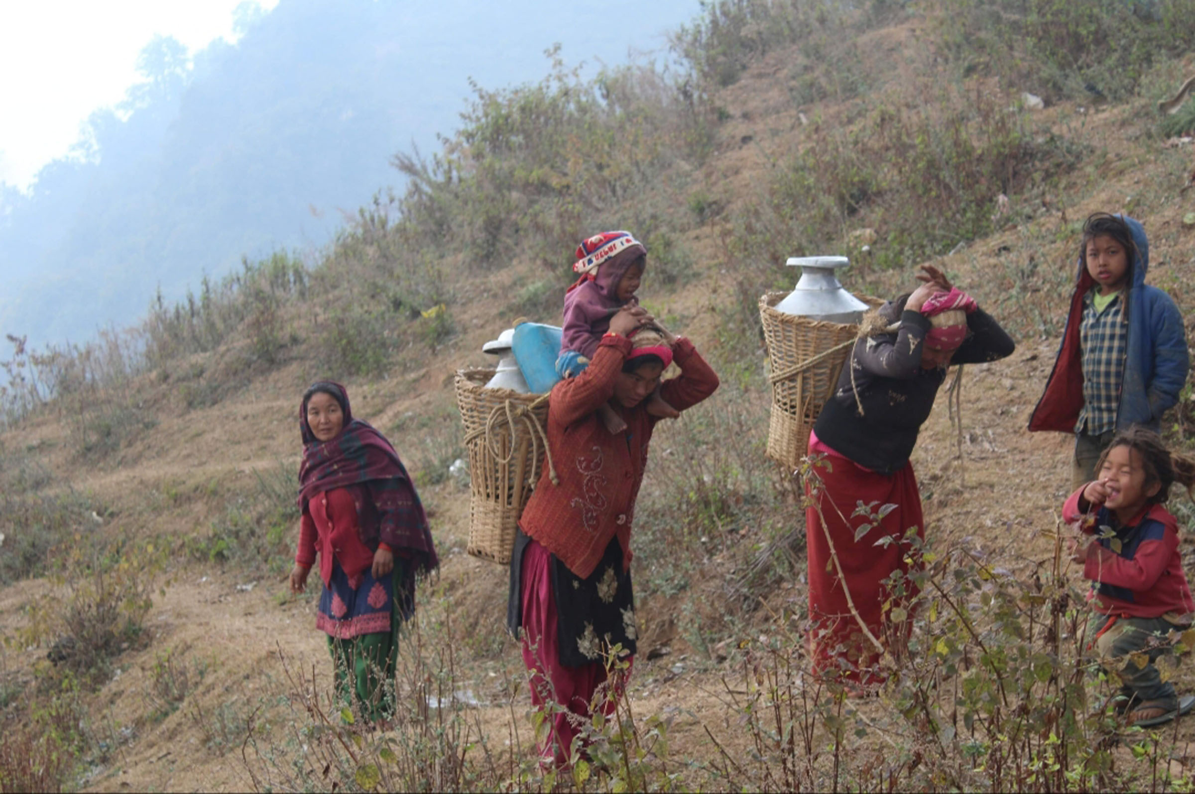 women-carry-water-vessles-on-their-back-to-home-in-ghorahi-sub-metropolitan-city-19